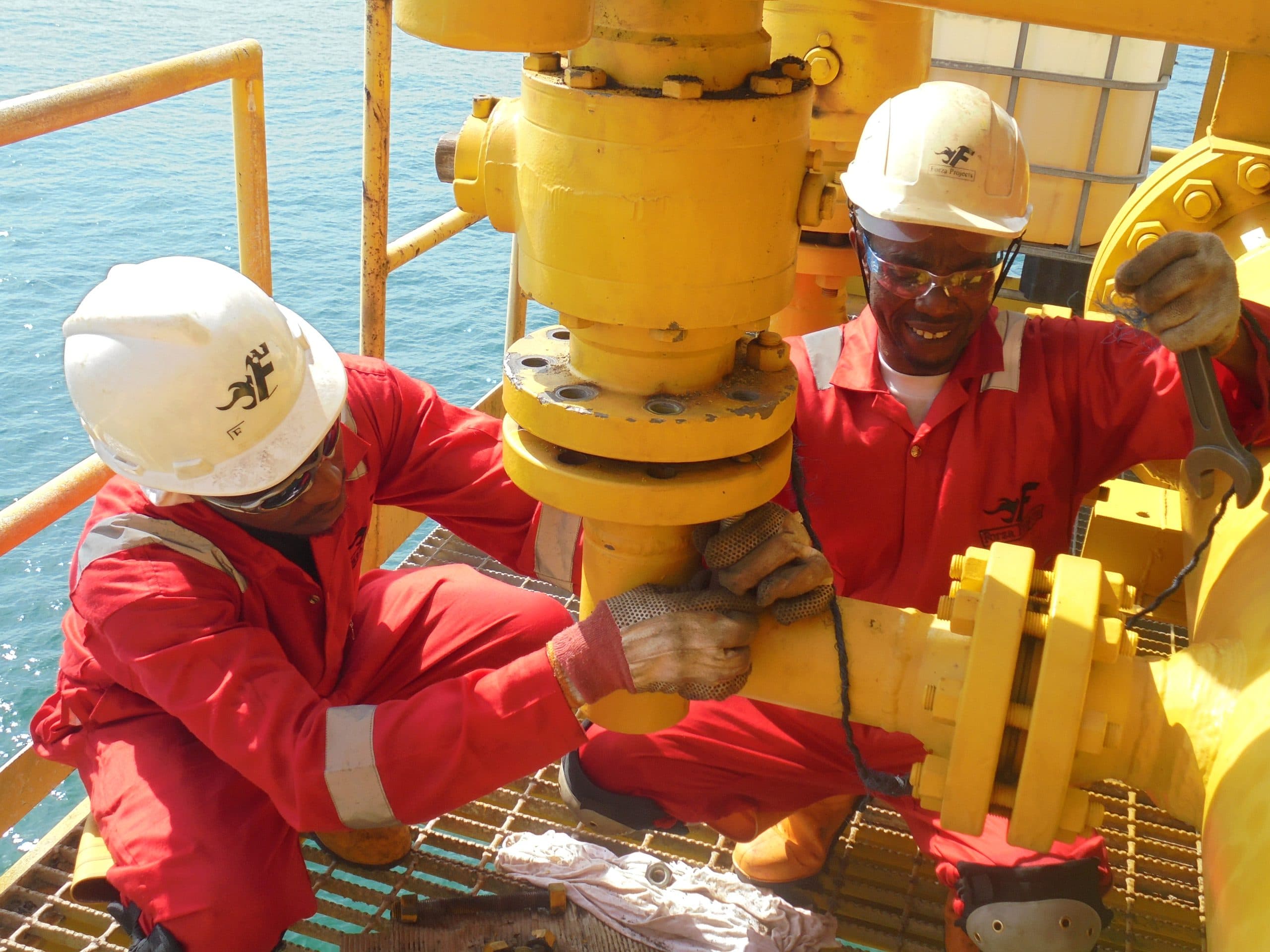 Forza Projects crew working a wellhead valve offshore